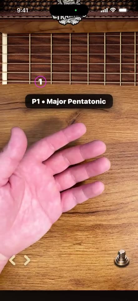 The AR Trainer reading finger placement on iPhone, like a guitar instructor watching your hand